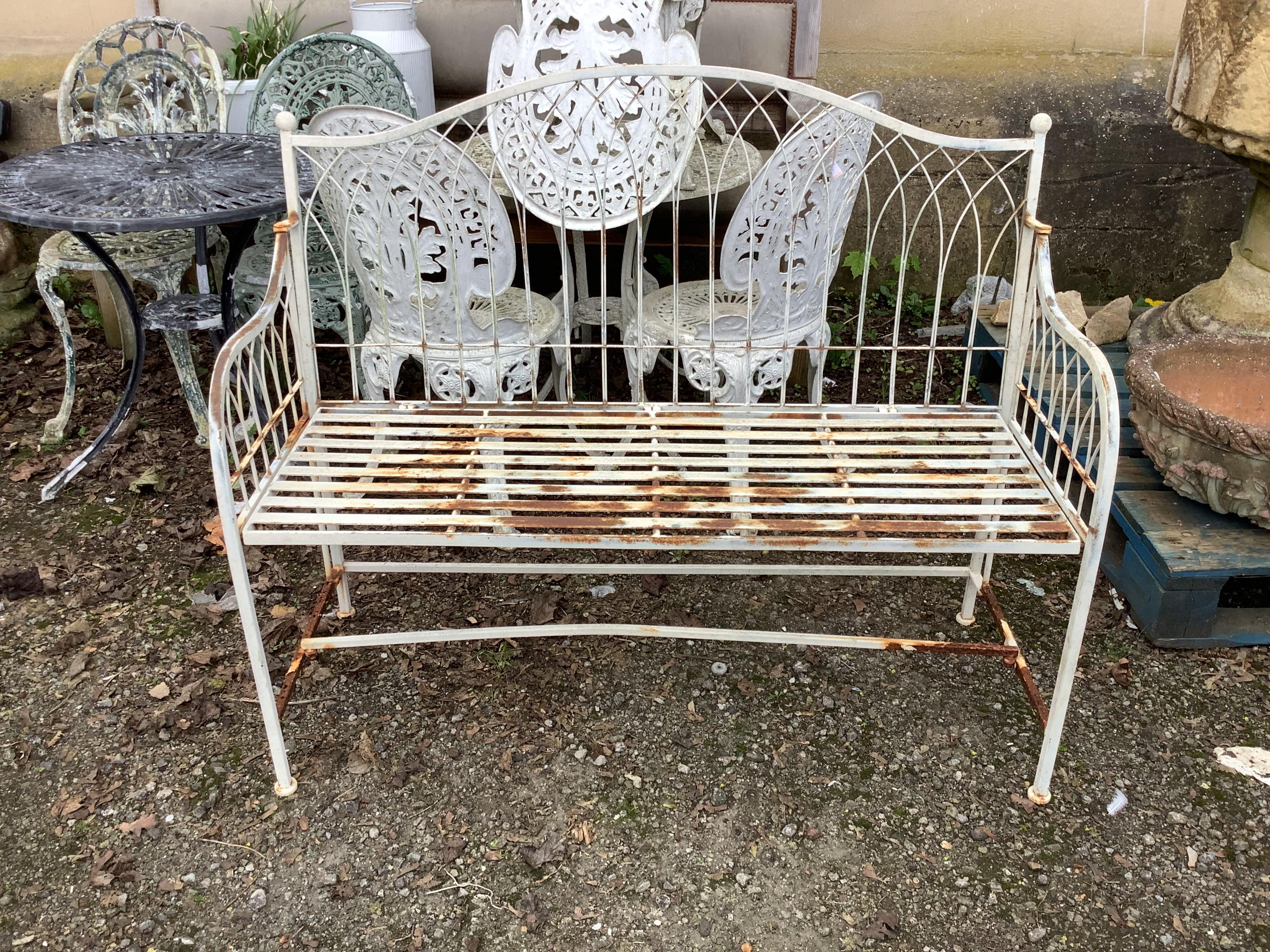 A painted metal folding garden bench, width 114cm, depth 43cm, height 95cm